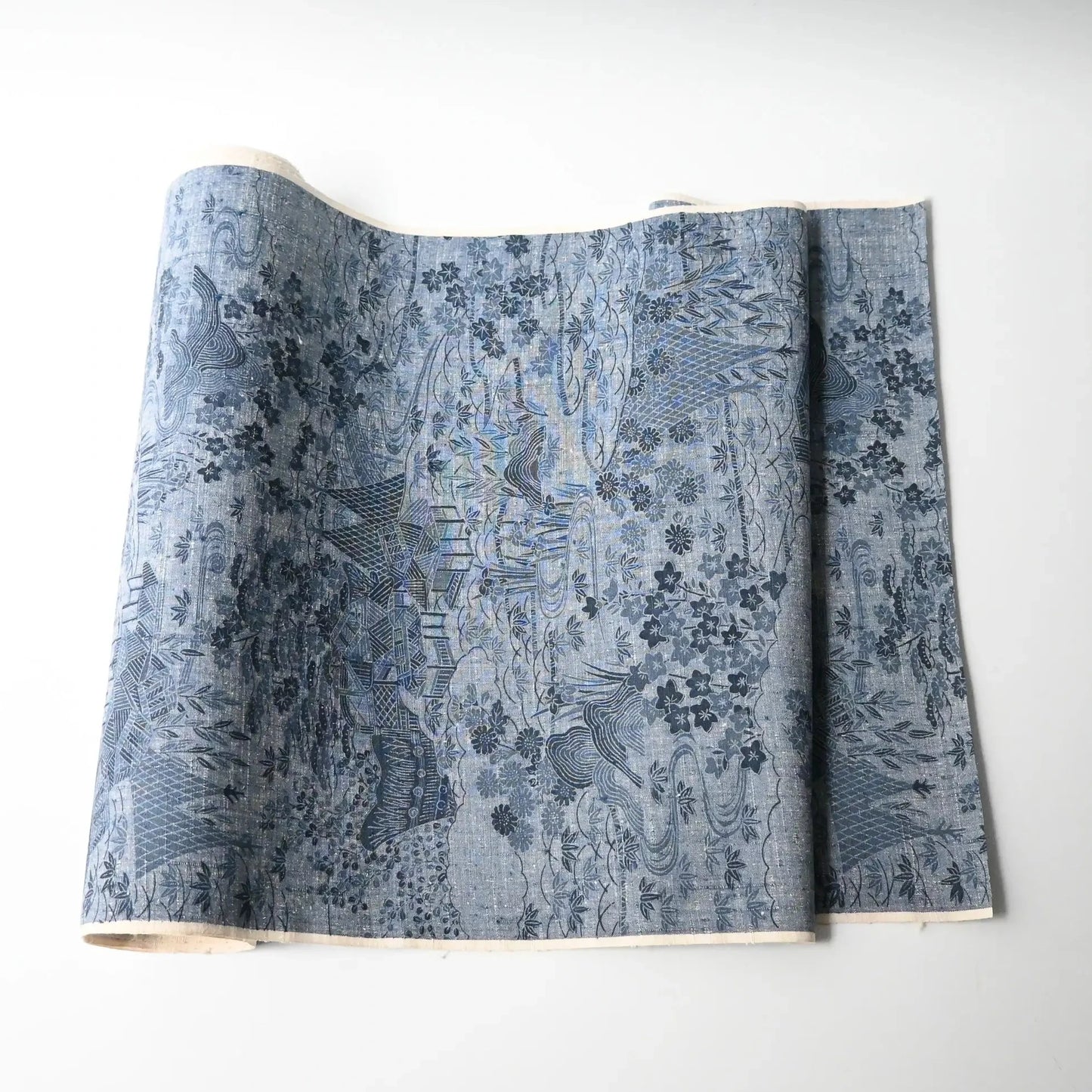 Vintage women's tsumugi silk kimono fabric in soft steel blue.