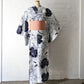 Vintage Japanese women's authentic yukata with rose motif paired with pink obi sash.
