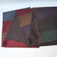 Full view of vintage Japanese women's silk textured geometric design Fukuro obi in warm rustic tones.