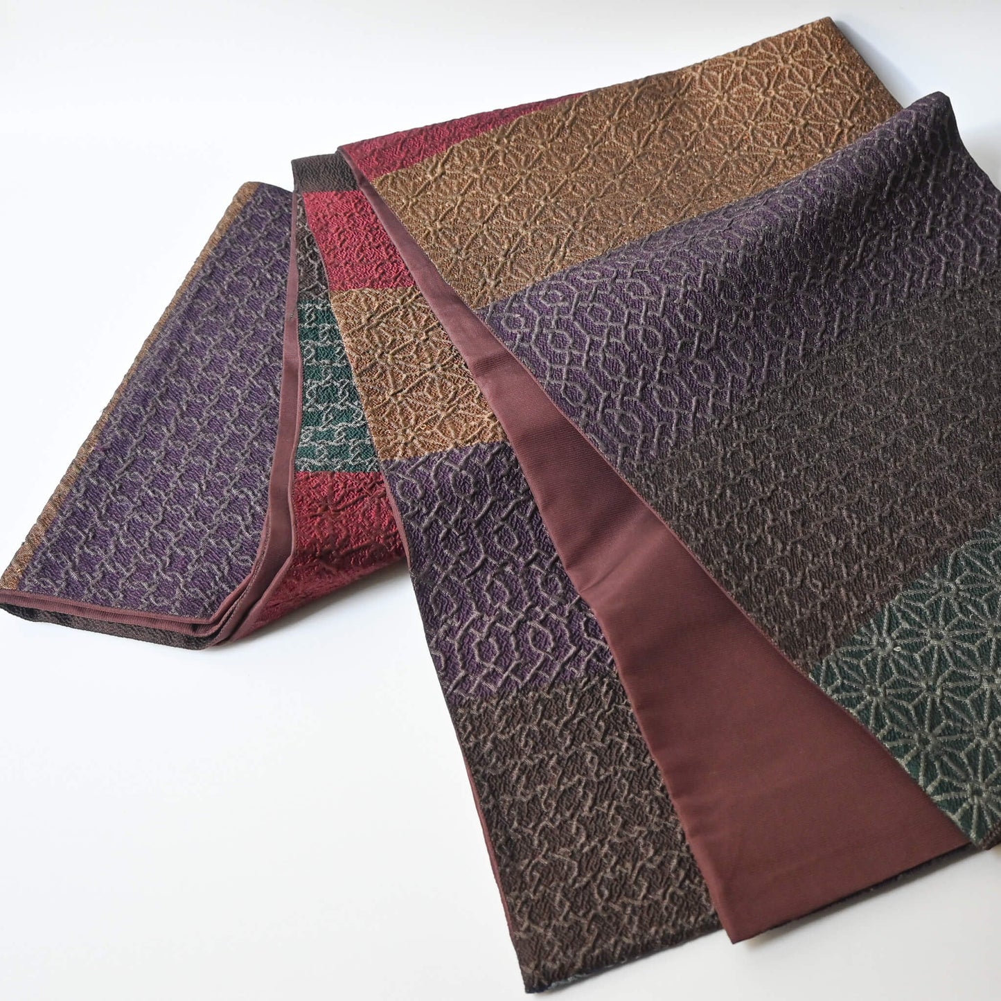 Full view of vintage Japanese women's silk textured geometric design Fukuro obi in warm rustic tones.