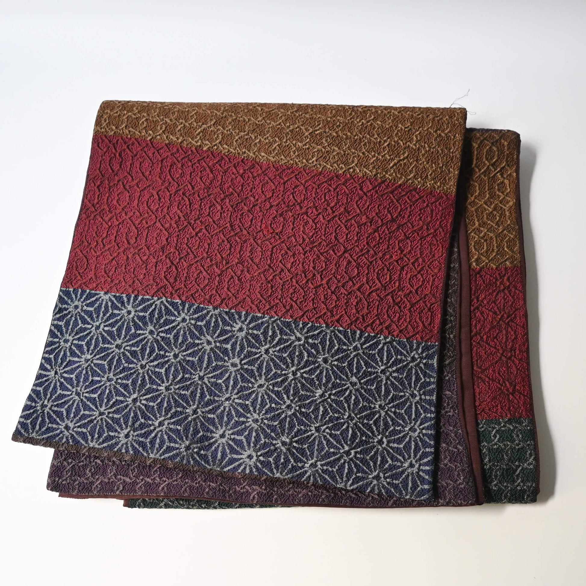 Vintage Japanese women's silk textured geometric design Fukuro obi in warm rustic tones.