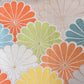 Detailed view of vintage women's white silk fukuro obi with colourful chrysanthemum motif.