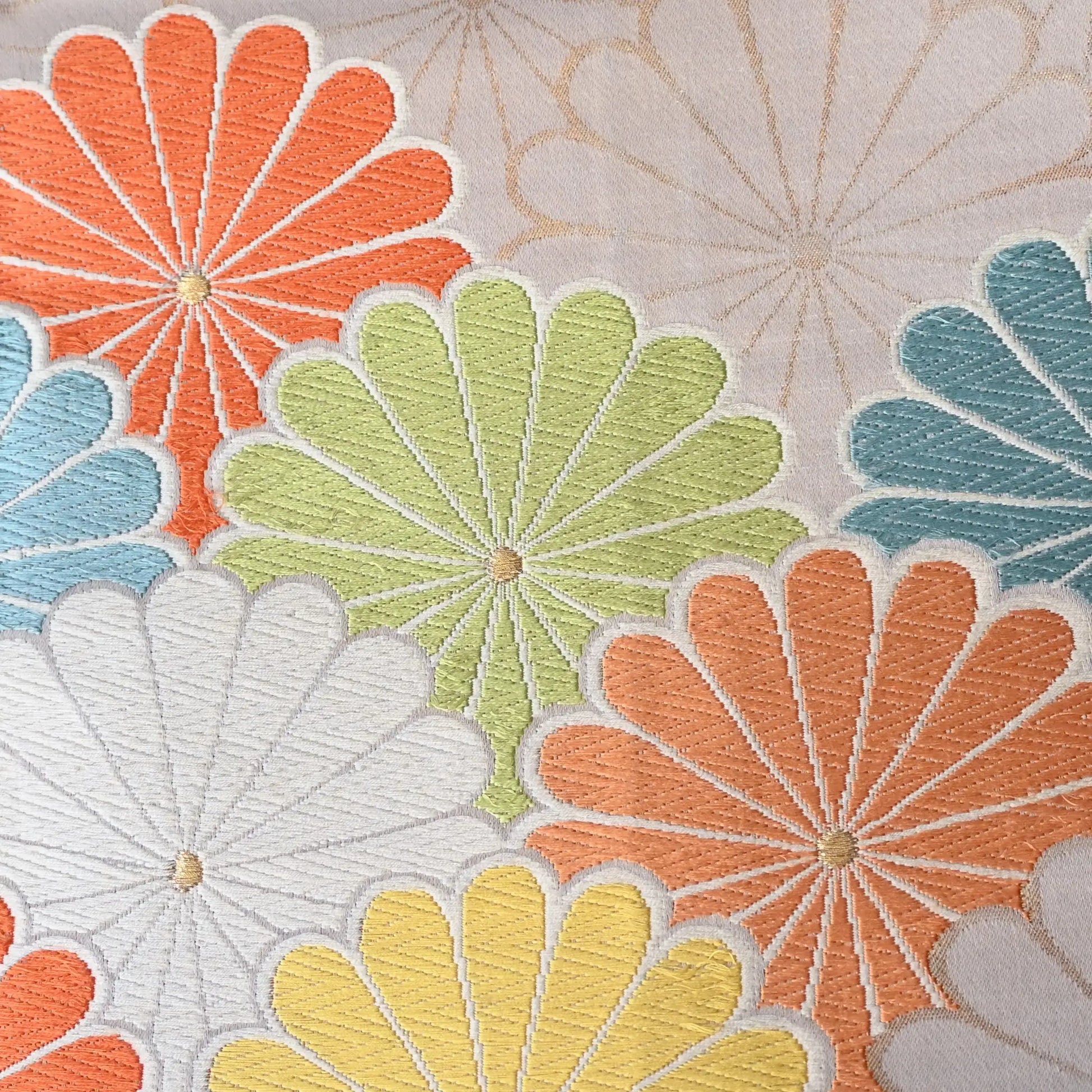 Detailed view of vintage women's white silk fukuro obi with colourful chrysanthemum motif.