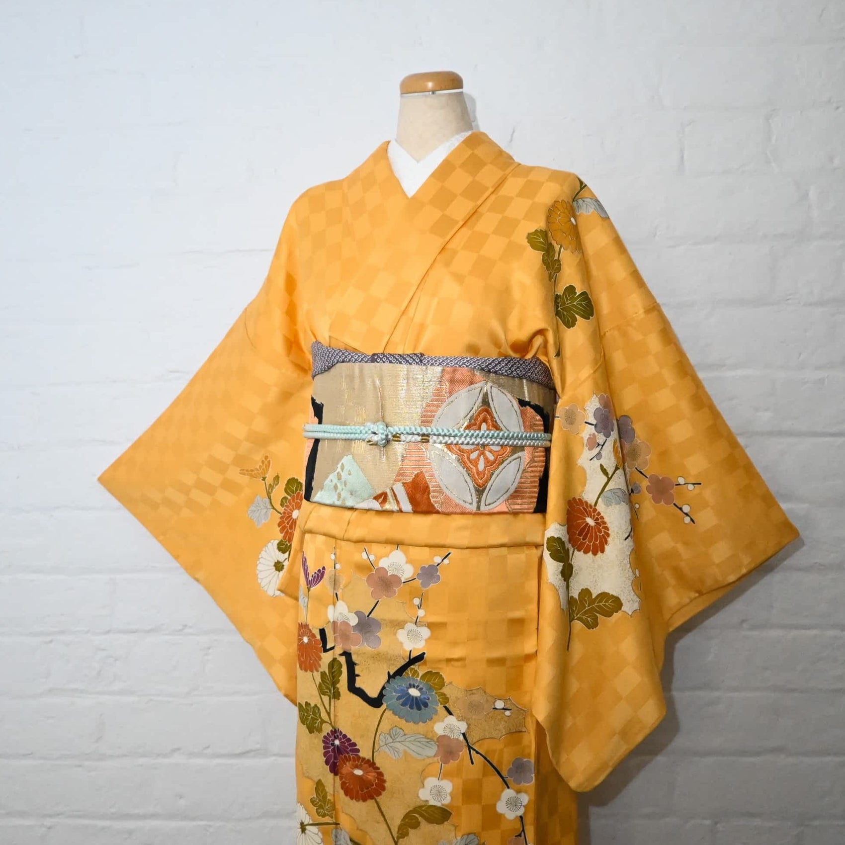 Vintage Japanese women's yellow silk jacquard semi-formal kimono with chrysanthemum, late Showa period.
