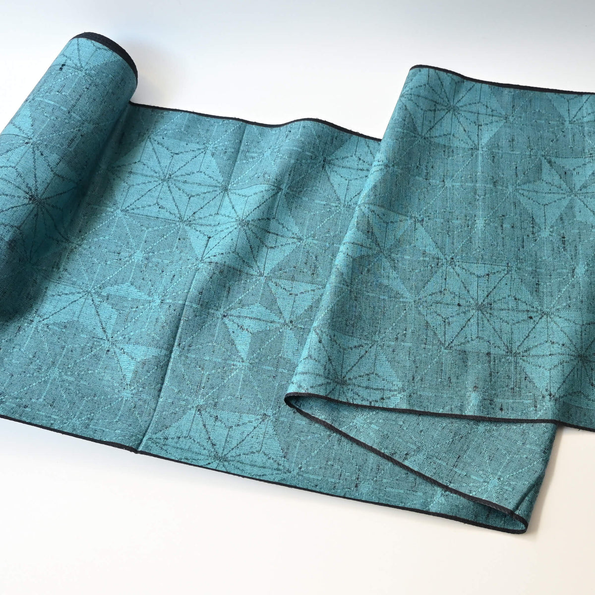 Vintage wool and silk blend kimono fabric in turquoise blue with asanoha motif, sold by the metre.