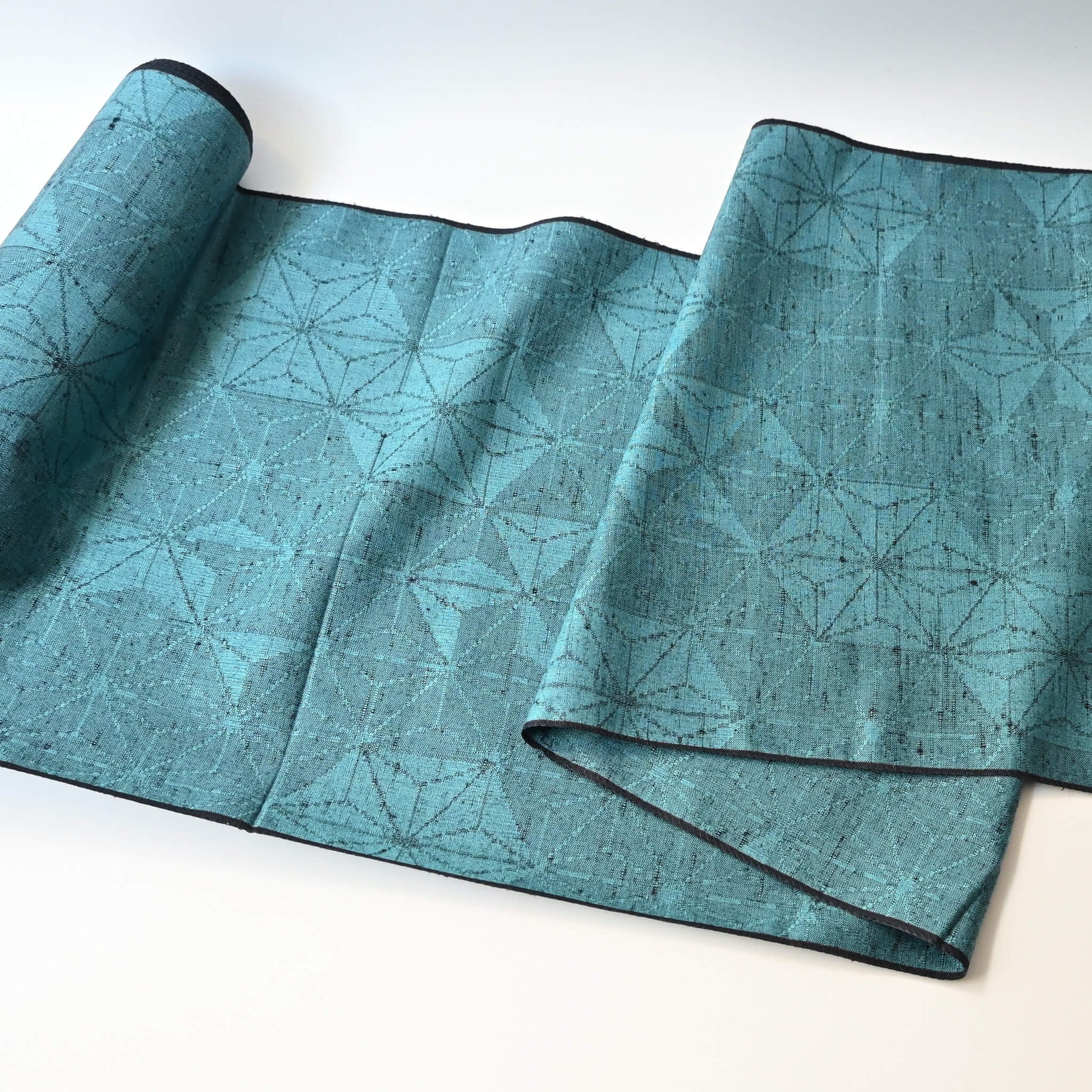 Vintage wool and silk blend kimono fabric in turquoise blue with asanoha motif, sold by the metre.