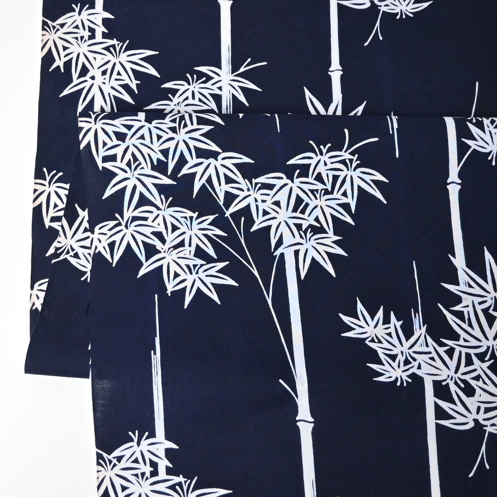 Vintage women's yukata cotton fabric with white maple motif on dark indigo base, sold by the metre.